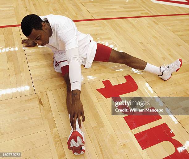 Guard Mike Ladd of the Washington State Cougars stretches during warm ups prior to the game against the Arizona Wildcats at Beasley Coliseum on...