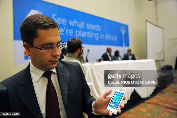 Microsoft Director, Mobility Windows Phone for Middle East and Africa, Gustavo Fuchs holds the Huawei 4Afrika, a full functionality Windows Phone 8...
