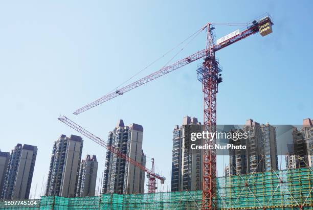 The logo of Evergrande Real Estate is seen at the construction site of a real estate project in Hangzhou, Zhejiang province, China, August 18, 2023....