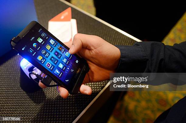 An attendee views the BlackBerry Z10 device during an event at the Empire Club of Canada in Toronto, Ontario, Canada, on Tuesday, Feb. 5, 2013....