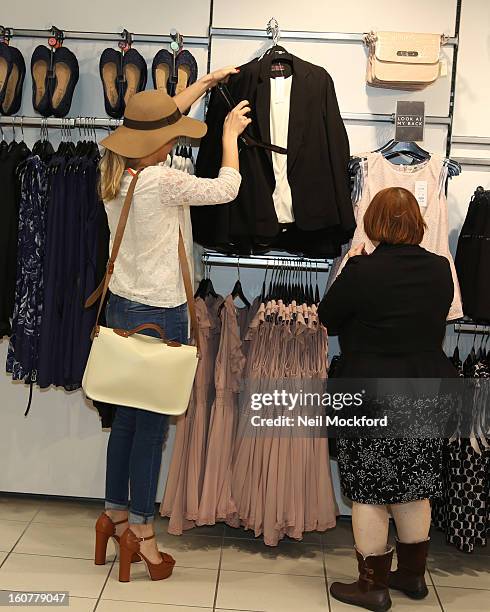 Lydia Bright gives Kate Brackley from "The Undateables" a makeover at New Look, Oxford St on February 5, 2013 in London, England.