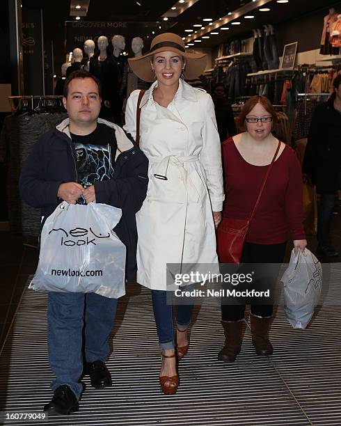 Lydia Bright gives Simon Macgregor and Kate Brackley from "The Undateables" a makeover at New Look, Oxford St on February 5, 2013 in London, England.