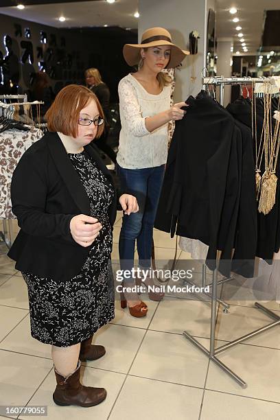 Lydia Bright gives Kate Brackley from "The Undateables" a makeover at New Look, Oxford St on February 5, 2013 in London, England.