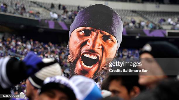Gary McHugh Jr. Lifts a visage of Baltimore Ravens' Ray Lewis during a Super Bowl celebration at M&T Bank Stadium in Baltimore, Maryland, Tuesday,...