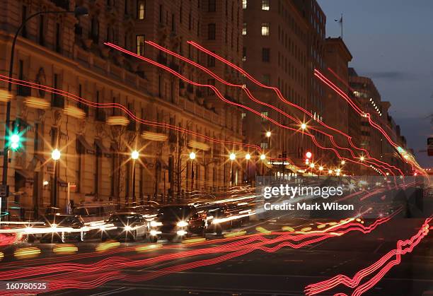 Traffic passes along 14th Street, February 5, 2013 in Washington, DC. Traffic congestion in Washington, DC is ranked the worst in the United States,...