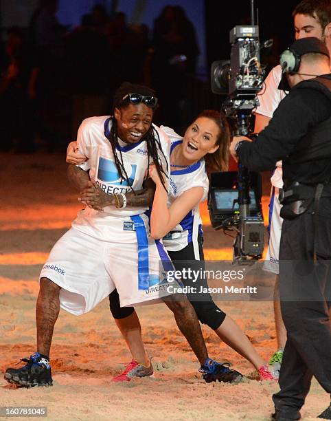 Rapper Lil Wayne attends DIRECTV'S Seventh Annual Celebrity Beach Bowl at DTV SuperFan Stadium at Mardi Gras World on February 2, 2013 in New...