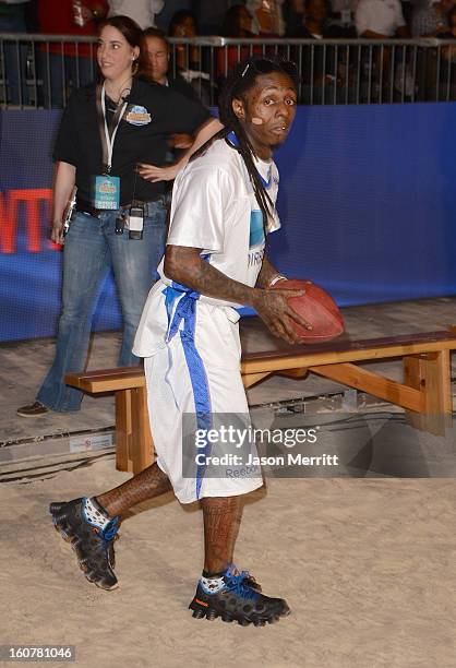 Rapper Lil Wayne attends DIRECTV'S Seventh Annual Celebrity Beach Bowl at DTV SuperFan Stadium at Mardi Gras World on February 2, 2013 in New...