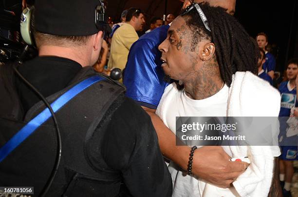 Rapper Lil Wayne attends DIRECTV'S Seventh Annual Celebrity Beach Bowl at DTV SuperFan Stadium at Mardi Gras World on February 2, 2013 in New...