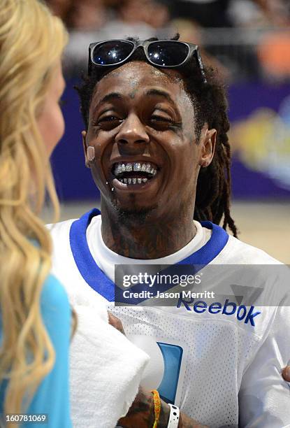 Rapper Lil Wayne attends DIRECTV'S Seventh Annual Celebrity Beach Bowl at DTV SuperFan Stadium at Mardi Gras World on February 2, 2013 in New...