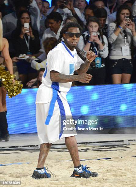 Rapper Lil Wayne attends DIRECTV'S Seventh Annual Celebrity Beach Bowl at DTV SuperFan Stadium at Mardi Gras World on February 2, 2013 in New...