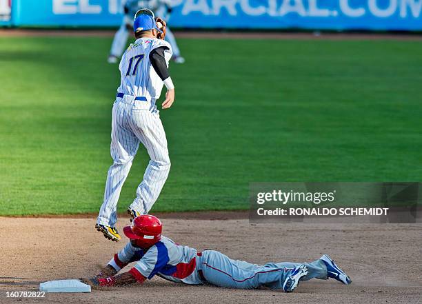 Rey Navarro of Criollos de Caguas of Puerto Rico, slides safe in second base in a match against Magallanes of Venezuela, during the 2013 Caribbean...