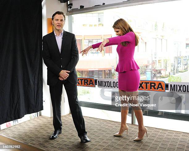 Maria Menounos impersonates a zombie with David Morrissey at Extra at The Grove on February 5, 2013 in Los Angeles, California.
