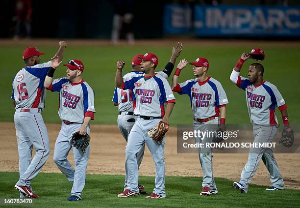 Players of Criollos de Caguas of Puerto Rico celebrate victory against Magallanes of Venezuela, during the 2013 Caribbean baseball series, on...