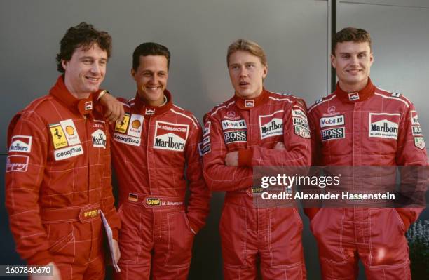 Northern Irish racing driver Eddie Irvine, German racing driver Michael Schumacher, Finnish racing driver Mika Hakkinen, and British racing driver...