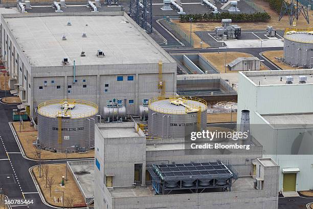 Storage tanks, center, stand at Korea Hydro & Nuclear Power Co.'s Shin-Kori nuclear power plant in Ulsan, South Korea, on Tuesday, Feb. 5, 2013....