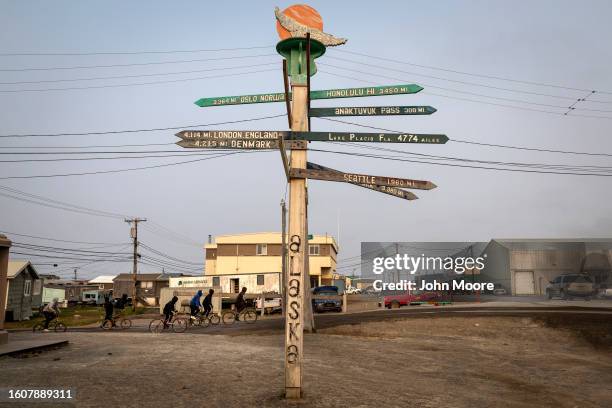 Signs point to distant cities on August 9, 2023 in Utqiagvik, Alaska. Located above the Arctic Circle, Utqiagvik is the northernmost settlement in...