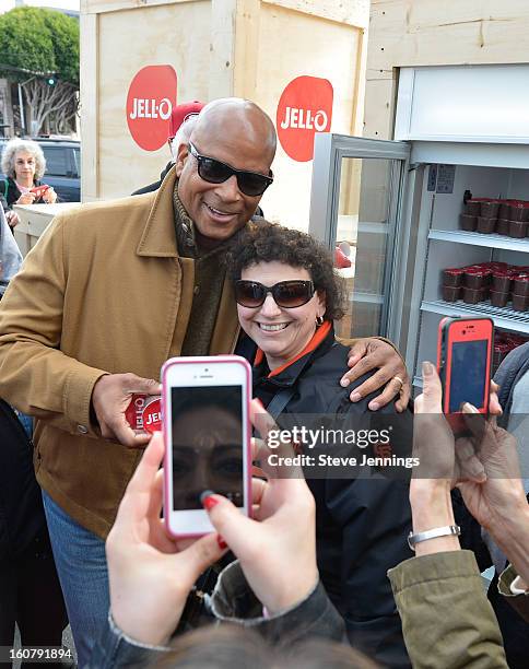 Ronnie Lott hands out JELL-O Pudding at the JELL-O Make The Taste of Defeat Sweet on February 5, 2013 in San Francisco, California.