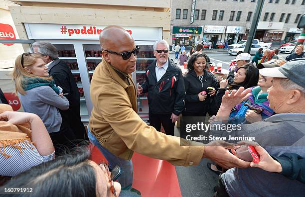 Ronnie Lott hands out JELL-O Pudding at the JELL-O Make The Taste of Defeat Sweet on February 5, 2013 in San Francisco, California.