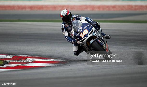 Aspar rider Randy De Puniet of France powers his bike on the second day of the pre-season MotoGP test at the Sepang circuit in Sepang outside Kuala...