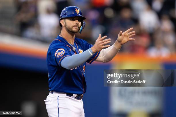 Pete Alonso of the New York Mets reacts as he stands on second base before his home run was confirmed by a video review during the first inning of...