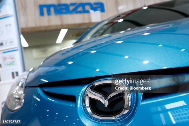 Mazda Motor Corp. Demio compact vehicle stands on display at the company's showroom in Tokyo, Japan, on Wednesday, Feb. 6, 2013. Mazda, the best...