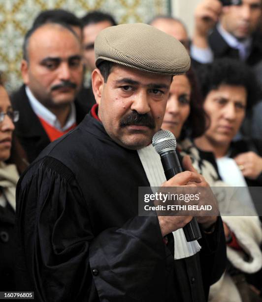 Picture taken on December 29, 2010 shows Tunisian lawyer and human rights activist Choukri Belaid speaking as he attends a meeting along with other...