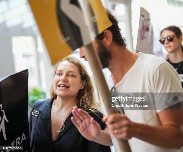 Merritt Wever and Ebon Moss-Bachrach join SAG-AFTRA members as they maintain picket lines across New York City on August 11, 2023 in New York City....