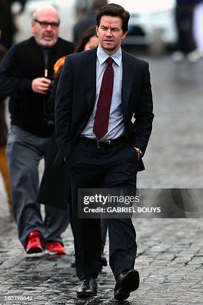 Actor Mark Wahlberg arrives to Piazza del Popolo in Rome on February 06 for a photo-call to promote his new film "Broken City". AFP PHOTO / GABRIEL...