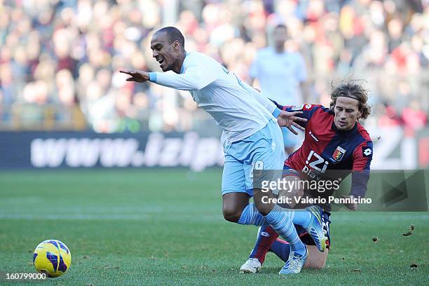 Abdoulay Konko of S.S. Lazio is tackled by Thomas Manfredini of Genoa during the Serie A match between Genoa CFC and SS Lazio at Stadio Luigi...