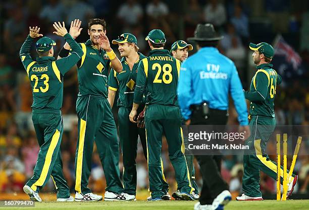 Mitchell Starc of Australia celebrates getting the wicket of Dwayne Bravo of the West Indies during the Commonwealth Bank One Day International...