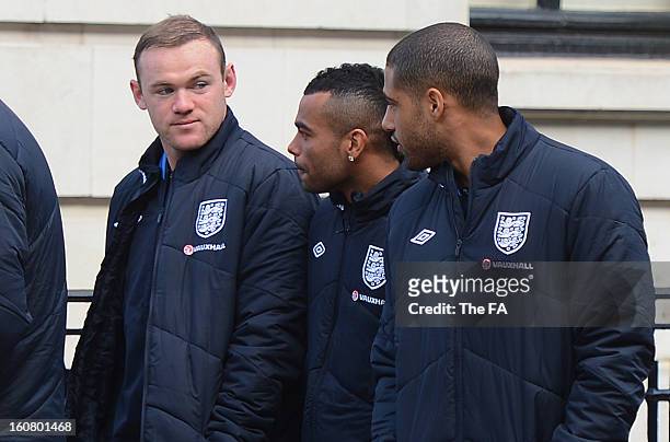 In this handout image provided by The FA, Wayne Rooney, Ashley Cole and Glen Johnson chat as the England squad go for a walk around Mayfair in London...