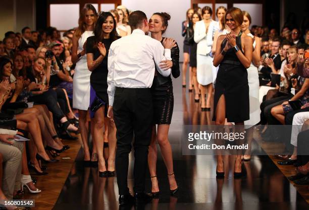 Miranda Kerr greets Dion Lee as she showcases designs by Dion Lee on the catwalk during the David Jones A/W 2013 Season Launch at David Jones...