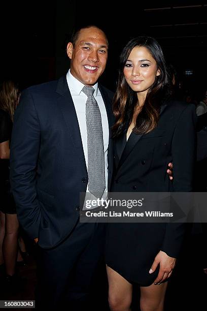 Geoff Huegill and Jessica Gomes pose during post show drinks at the David Jones A/W 2013 Season Launch at David Jones Castlereagh Street on February...