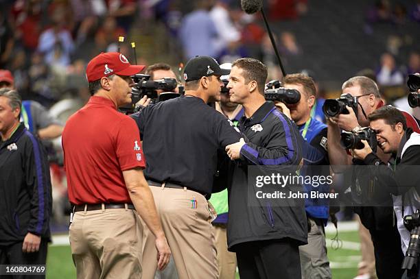 Super Bowl XLVII: Baltimore Ravens head coach John Harbaugh greeting San Francisco 49ers head coach Jim Harbaugh on field before game at...