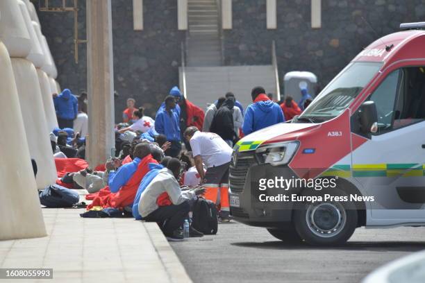 Several immigrants are attended by the emergency services in the port of La Restinga, on 11 August, 2023 in El Pinar de El Hierro, El Hierro, Canary...