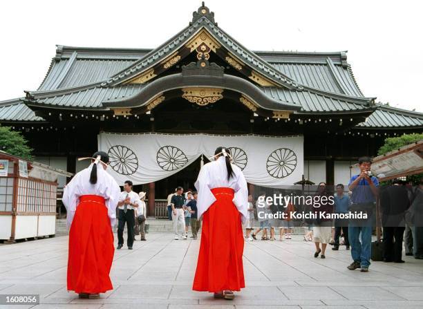 Traditionally dressed visitors pay their respects August 9, 2001 at the Yasukuni Shrine in Tokyo, Japan. The Shinto shrine is dedicated to Japan''s...