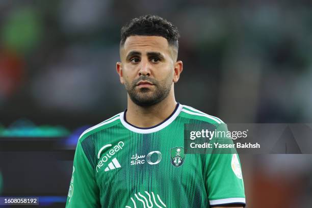 Riyad Mahrez of Al-Ahli lines up prior to the Saudi Pro League match between Al-Ahli Saudi and Al-Hazm at the Prince Abdullah AlFaisal stadium on...