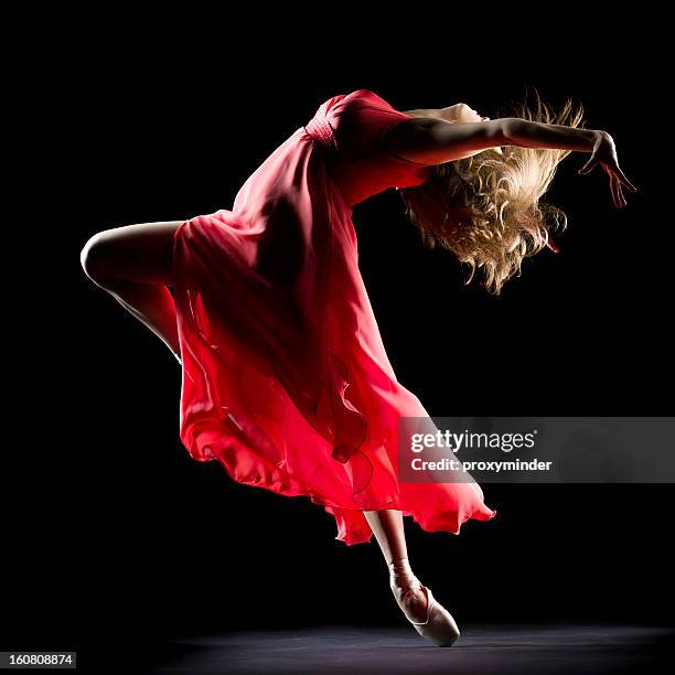 the dancer on black background - red dress stock pictures, royalty-free photos & images