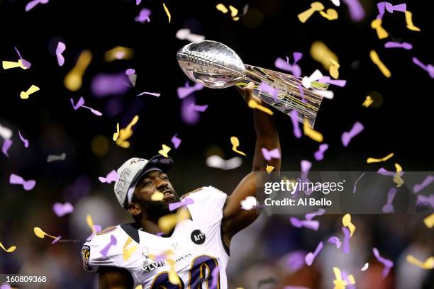 Ed Reed of the Baltimore Ravens celebrates with the Vince Lombardi Championship trophy as confetti falls after the Ravens won 34-31 against the San...