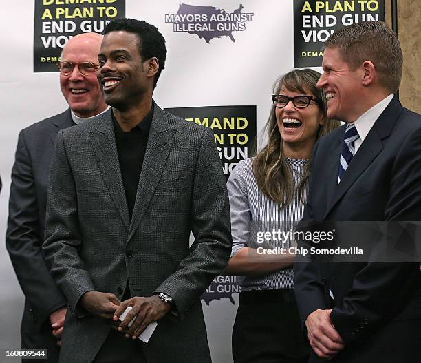 The Rev. Thomthy Boggs, actor Chris Rock, actor Amanda Peet and former ATF Agent David Chipman share a laugh during a press conference hosted by...