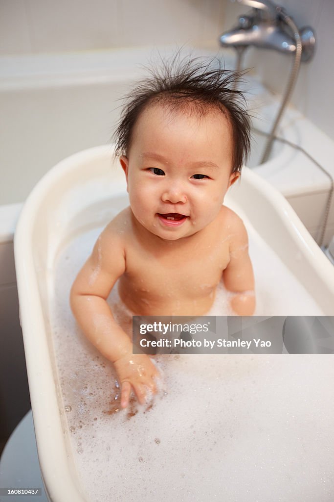 Baby girl taking bath