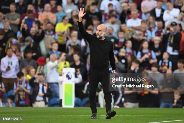 Josep Guardiola, Head Coach of Manchester City, acknowledges the fans prior to the Premier League match between Burnley FC and Manchester City at...