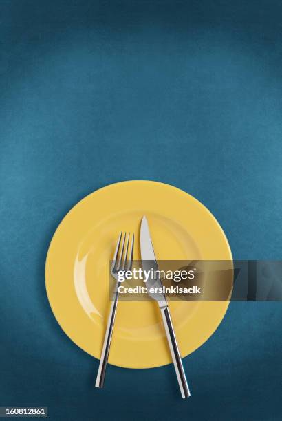 plate, fork and table knife - blue plate stock pictures, royalty-free photos & images