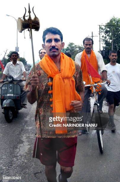 Indian Hindu devotee Kamal Kishore begins his seven day pilgrimage to the Amarnath Cave Shrine, some 650 kilometers from Amritsar on 12 July 2005....
