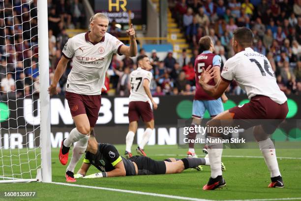 Erling Haaland of Manchester City celebrates after scoring the team's first goal during the Premier League match between Burnley FC and Manchester...