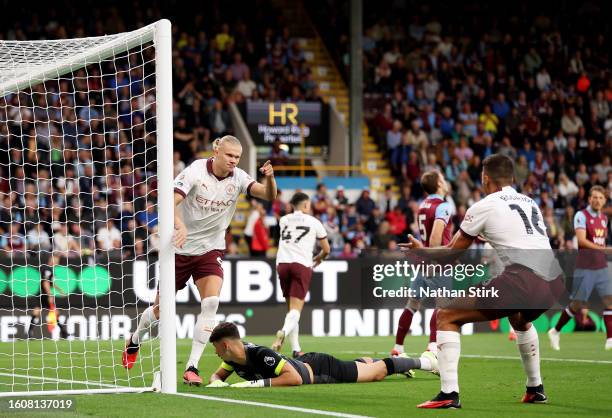 Erling Haaland of Manchester City celebrates after scoring the team's first goal during the Premier League match between Burnley FC and Manchester...