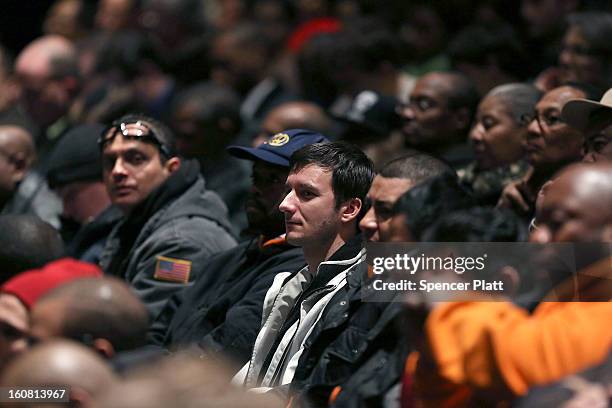 City College students watch as New York Governor Andrew Cuomo delivers his State of the State and budget proposals at The City College of New York on...