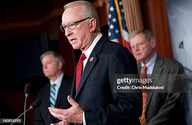 Sen. Lindsey Graham, R-S.C.; House Armed Services Chairman Buck McKeon, R-Calif.; and Sen. James Inhofe, R-Okla., speak at a press conference to...