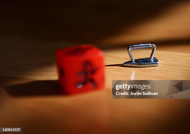 In this photo illustration, The Monopoly iron game piece is displayed on February 6, 2013 in Fairfax, California. Toy maker Hasbro, Inc. Announced...