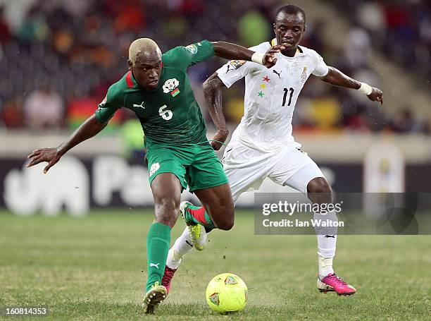 Kone Djakaridja of Burkina Faso competes for the ball with Mohammed Rabiu Alhassan of Ghana during the 2013 Africa Cup of Nations Semi-Final match...